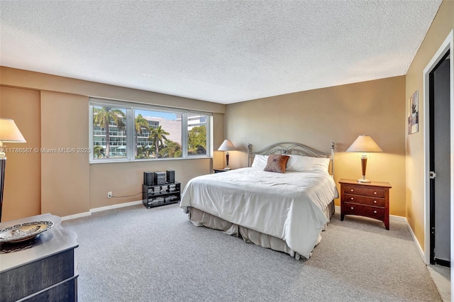 3000 Holiday Dr Unit 306, Fort Lauderdale, FL 33316 - carpeted bedroom featuring a textured ceiling and baseboards