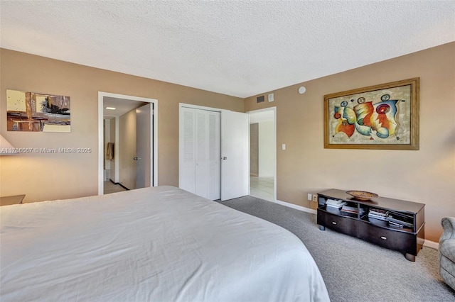 3000 Holiday Dr Unit 306, Fort Lauderdale, FL 33316 - bedroom featuring carpet flooring, baseboards, a textured ceiling, and a closet