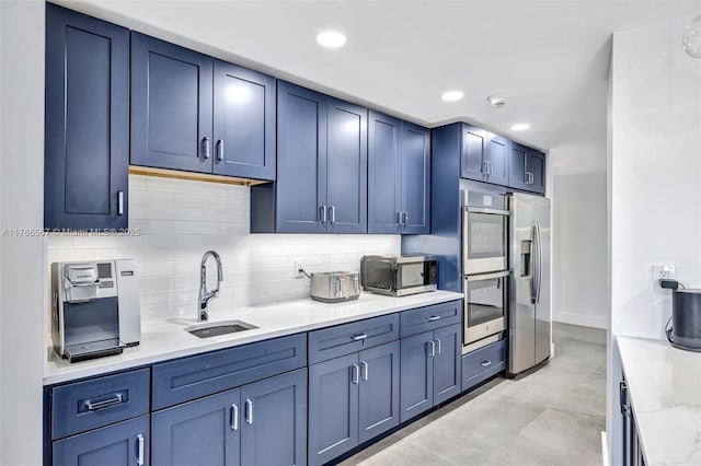 3000 Holiday Dr Unit 306, Fort Lauderdale, FL 33316 - kitchen with stainless steel appliances, a sink, decorative backsplash, recessed lighting, and blue cabinetry