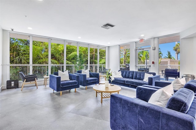3000 Holiday Dr Unit 306, Fort Lauderdale, FL 33316 - living room with a wall of windows, recessed lighting, and concrete floors