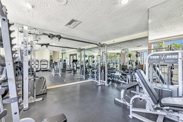 3000 Holiday Dr Unit 306, Fort Lauderdale, FL 33316 - exercise room with a textured ceiling