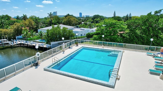 3000 Holiday Dr Unit 306, Fort Lauderdale, FL 33316 - community pool featuring fence, a water view, and a patio