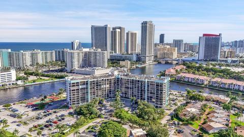 aerial view of a nearby body of water and a view of skyline