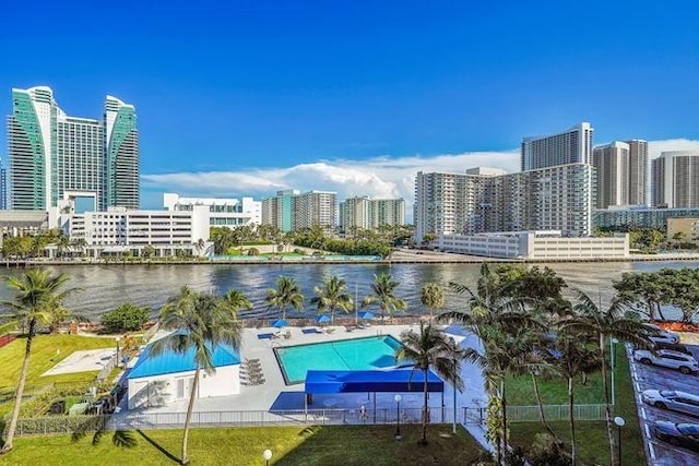 view of pool featuring a view of skyline and a water view