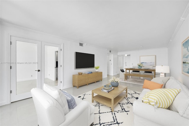 living room featuring ornamental molding and baseboards