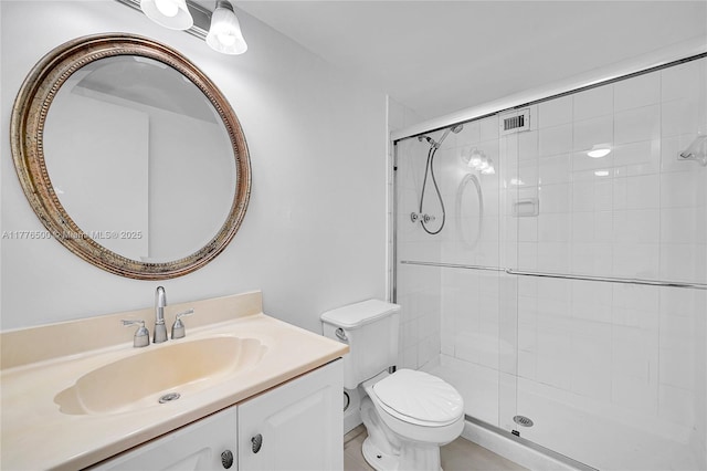 full bathroom with a shower stall, toilet, and vanity