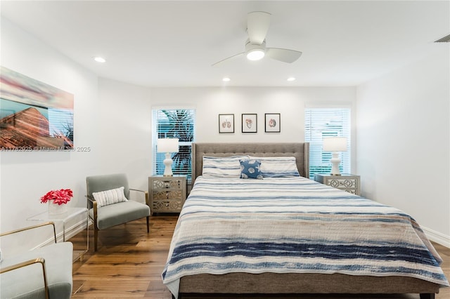 bedroom featuring a ceiling fan, wood finished floors, and recessed lighting