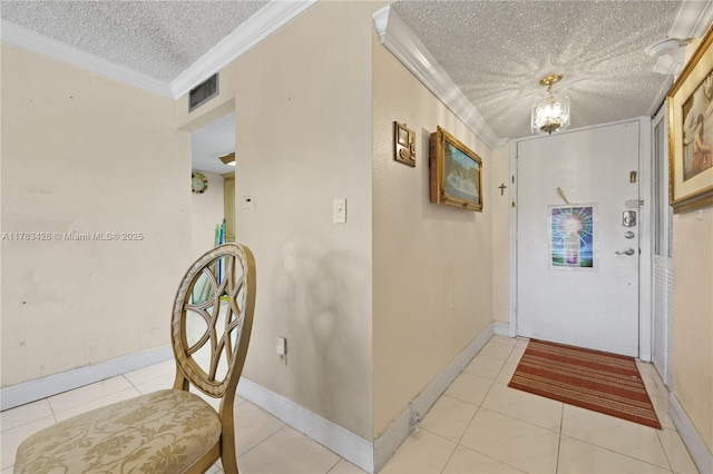 corridor with a textured ceiling, light tile patterned flooring, visible vents, an inviting chandelier, and crown molding