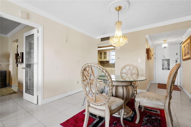 dining room with visible vents, light tile patterned floors, crown molding, a textured ceiling, and a notable chandelier