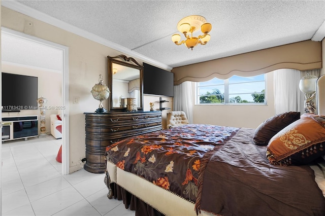bedroom with ornamental molding, a textured ceiling, and light tile patterned floors