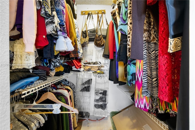 walk in closet featuring tile patterned flooring