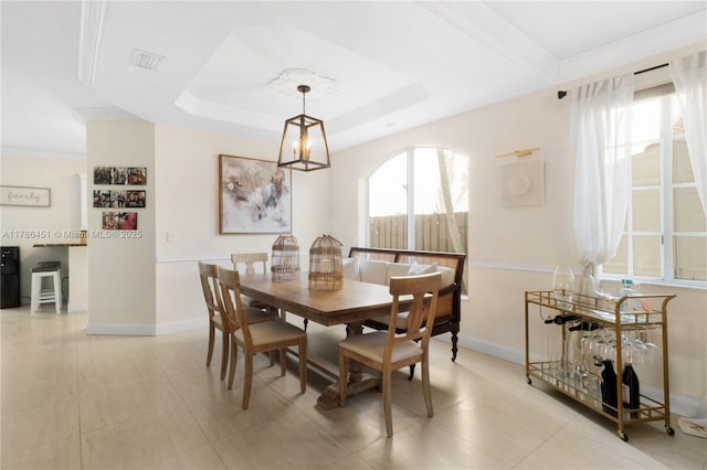 dining space featuring visible vents, baseboards, ornamental molding, and light tile patterned flooring