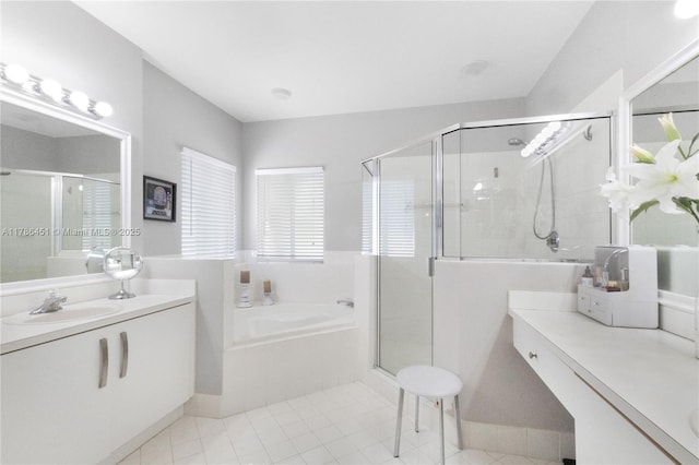 bathroom featuring a bath, vanity, tile patterned flooring, and a stall shower