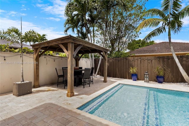 view of pool featuring a fenced backyard, a gazebo, a patio, and a fenced in pool