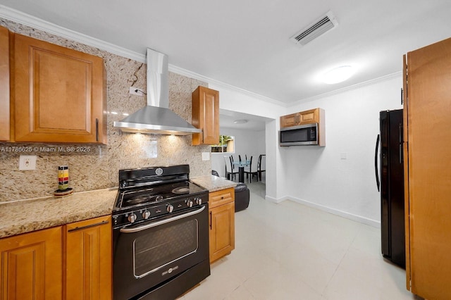 6200 Wiley St, Hollywood, FL 33023 - kitchen with stainless steel microwave, freestanding refrigerator, visible vents, range with gas stovetop, and wall chimney range hood