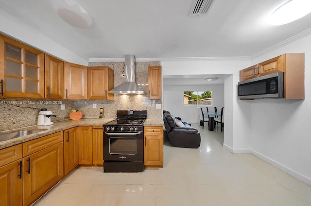 6200 Wiley St, Hollywood, FL 33023 - kitchen featuring crown molding, black gas range oven, stainless steel microwave, and wall chimney range hood