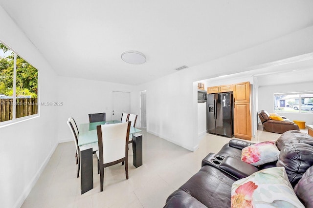 6200 Wiley St, Hollywood, FL 33023 - dining area with baseboards, visible vents, and plenty of natural light