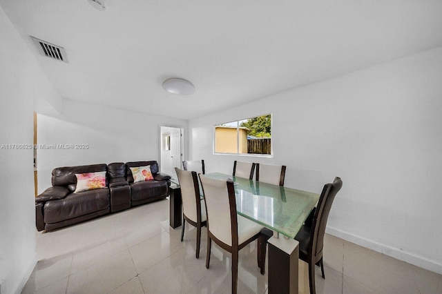 6200 Wiley St, Hollywood, FL 33023 - dining area with baseboards, light tile patterned flooring, and visible vents