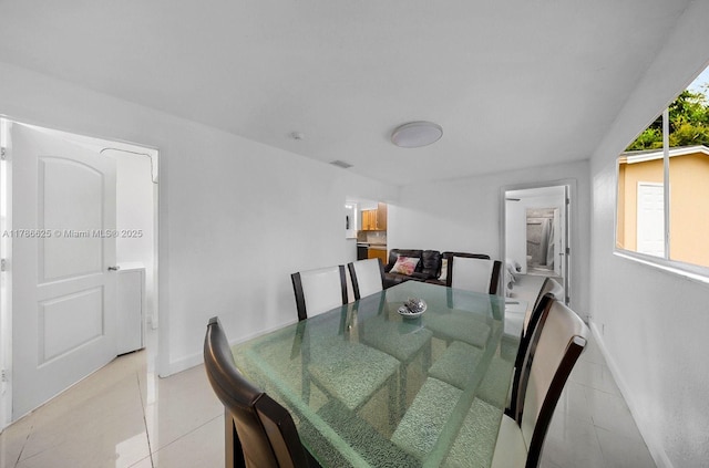 6200 Wiley St, Hollywood, FL 33023 - dining room with baseboards, light tile patterned flooring, and visible vents