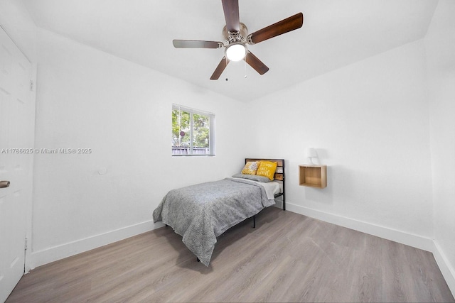 6200 Wiley St, Hollywood, FL 33023 - bedroom featuring light wood-style flooring, a ceiling fan, and baseboards