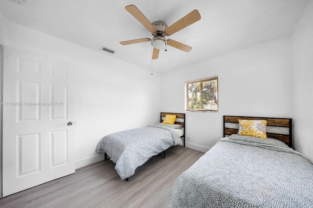 6200 Wiley St, Hollywood, FL 33023 - bedroom featuring light wood-type flooring, a ceiling fan, baseboards, and visible vents