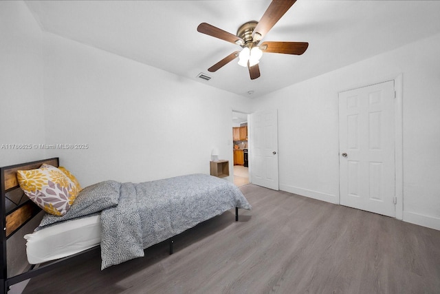 6200 Wiley St, Hollywood, FL 33023 - bedroom with ceiling fan, baseboards, wood finished floors, and visible vents