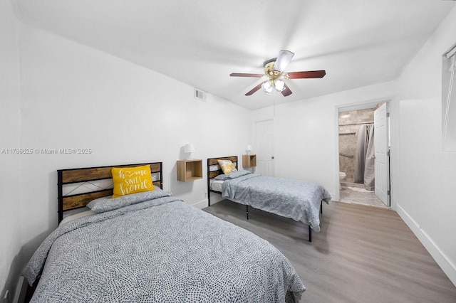 6200 Wiley St, Hollywood, FL 33023 - bedroom with wood finished floors, visible vents, baseboards, and ceiling fan