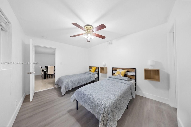 6200 Wiley St, Hollywood, FL 33023 - bedroom with visible vents, wood finished floors, baseboards, and a ceiling fan