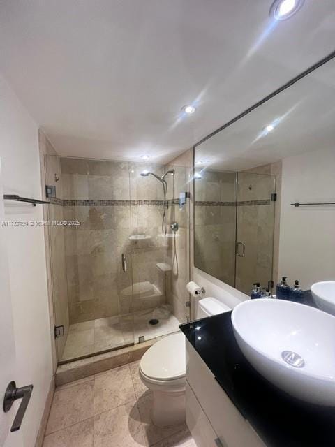 600 NE 36th St Unit 1706, Miami, FL 33137 - bathroom with toilet, a stall shower, vanity, recessed lighting, and tile patterned floors