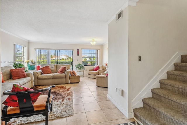 844 SW 134th Pl, Miami, FL 33184 - living area with crown molding, light tile patterned flooring, visible vents, and plenty of natural light