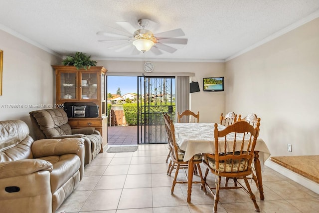 844 SW 134th Pl, Miami, FL 33184 - dining space with crown molding, a textured ceiling, a ceiling fan, and light tile patterned floors