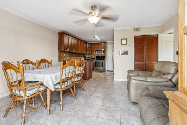 844 SW 134th Pl, Miami, FL 33184 - dining space with visible vents, light tile patterned floors, crown molding, baseboards, and ceiling fan