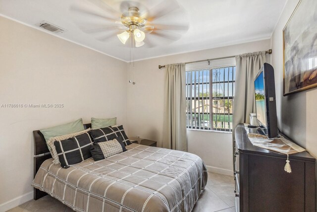 844 SW 134th Pl, Miami, FL 33184 - tiled bedroom featuring baseboards, a ceiling fan, crown molding, and visible vents
