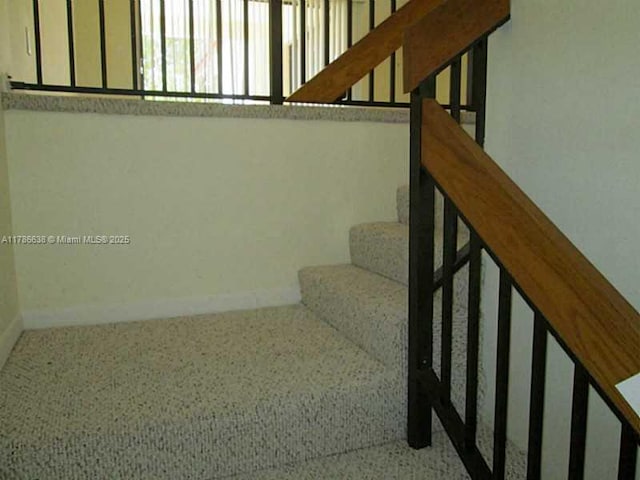 323 Ives Dairy Rd Unit 323-05, Miami, FL 33179 - stairs featuring baseboards and carpet floors