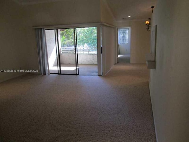 323 Ives Dairy Rd Unit 323-05, Miami, FL 33179 - empty room featuring light carpet, a notable chandelier, and recessed lighting
