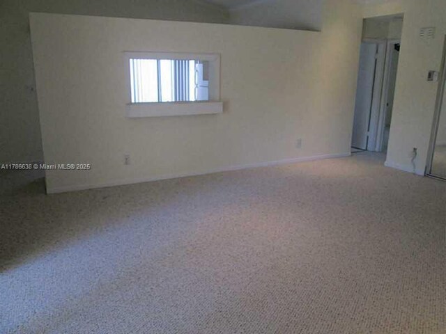 323 Ives Dairy Rd Unit 323-05, Miami, FL 33179 - carpeted spare room with baseboards
