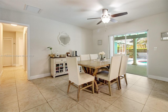 dining space with visible vents, baseboards, ceiling fan, and light tile patterned floors