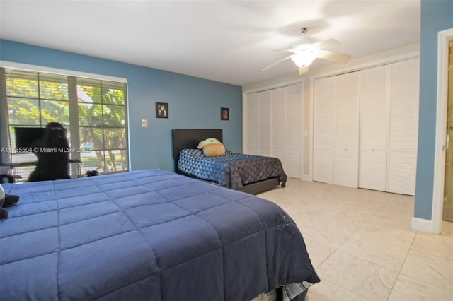 bedroom with two closets and ceiling fan