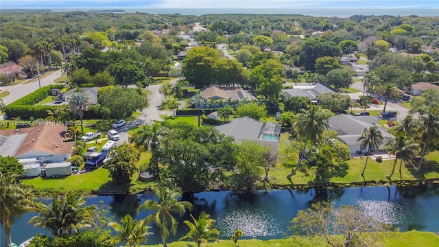 birds eye view of property featuring a water view and a residential view