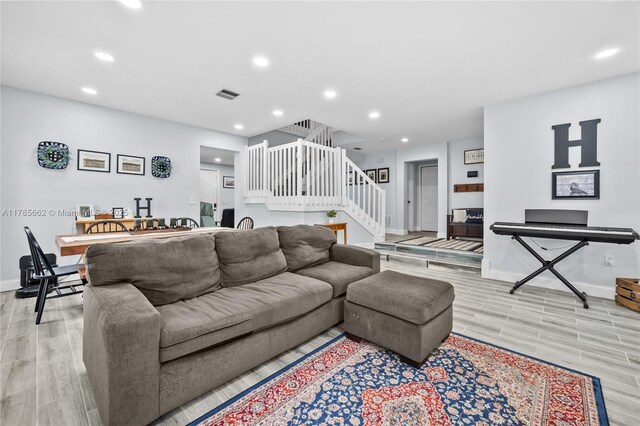 11640 SW 243rd St, Homestead, FL 33032 - living area with stairway, light wood-style floors, visible vents, and recessed lighting