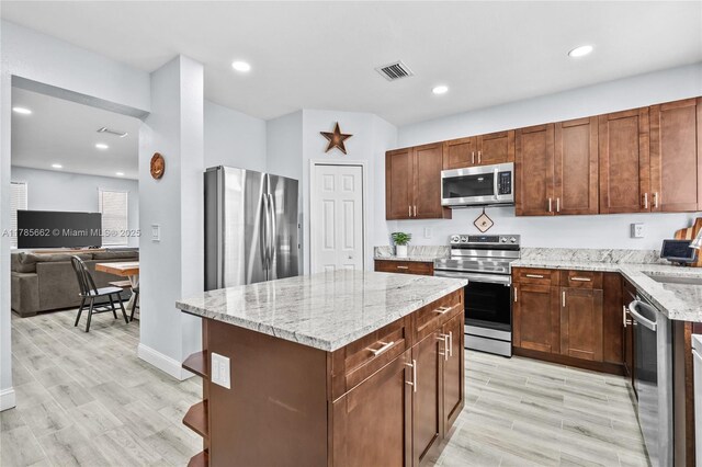 11640 SW 243rd St, Homestead, FL 33032 - kitchen featuring stainless steel appliances, light wood-style flooring, visible vents, and a sink