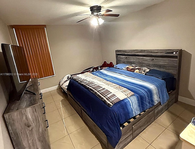 8820 Fontainebleau Blvd Unit 104, Miami, FL 33172 - bedroom with a ceiling fan, baseboards, and light tile patterned floors