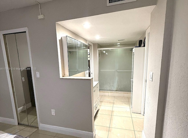 8820 Fontainebleau Blvd Unit 104, Miami, FL 33172 - corridor featuring baseboards, visible vents, and light tile patterned floors