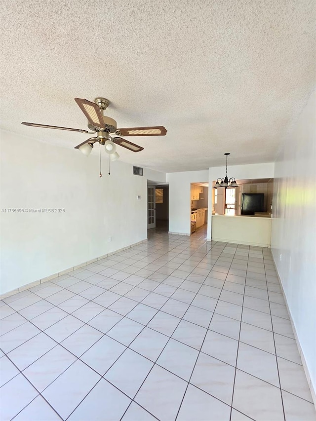 1900 W 54th St Unit 120, Hialeah, FL 33012 - spare room with a textured ceiling, visible vents, and ceiling fan with notable chandelier