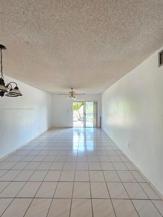 1900 W 54th St Unit 120, Hialeah, FL 33012 - unfurnished room with visible vents, ceiling fan, a textured ceiling, and light tile patterned flooring