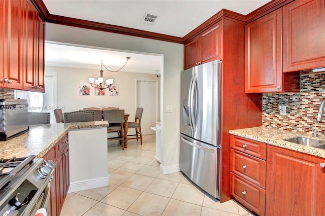 kitchen featuring tasteful backsplash, visible vents, stainless steel appliances, and a sink