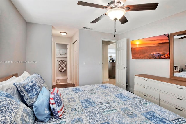 bedroom featuring visible vents, connected bathroom, a ceiling fan, and baseboards