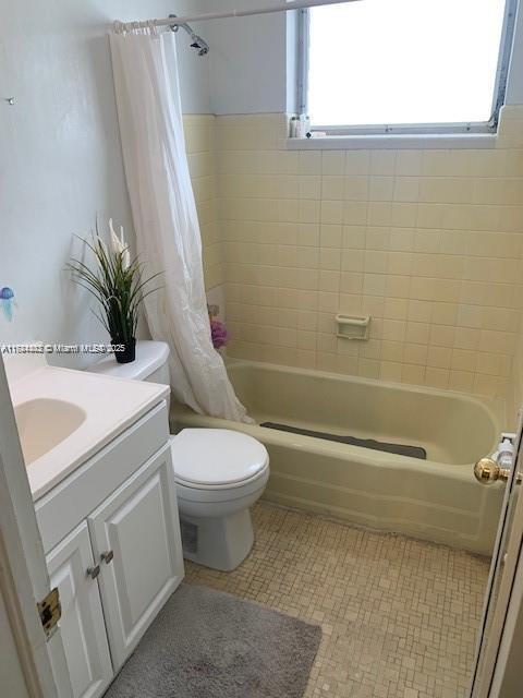 200 76th St Unit 57, Miami Beach, FL 33141 - full bathroom with shower / bath combo with shower curtain, toilet, and vanity