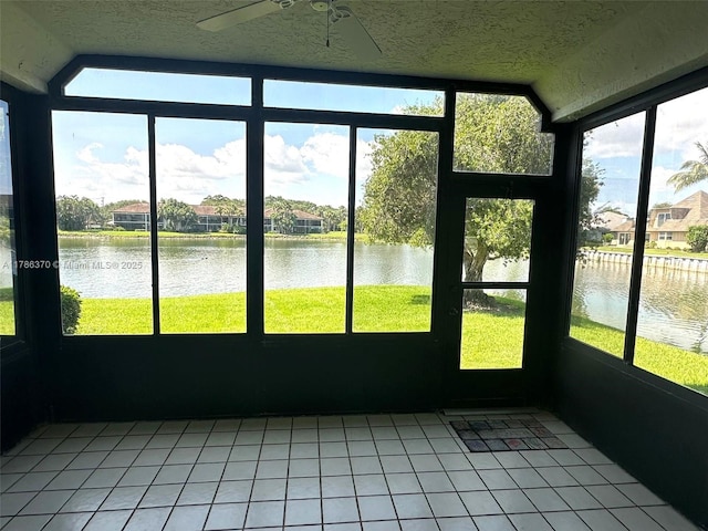 6081 SE Landing Way Unit 8, Stuart, FL 34997 - unfurnished sunroom featuring lofted ceiling, a water view, a ceiling fan, and a residential view