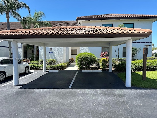 6081 SE Landing Way Unit 8, Stuart, FL 34997 - view of partially covered parking lot